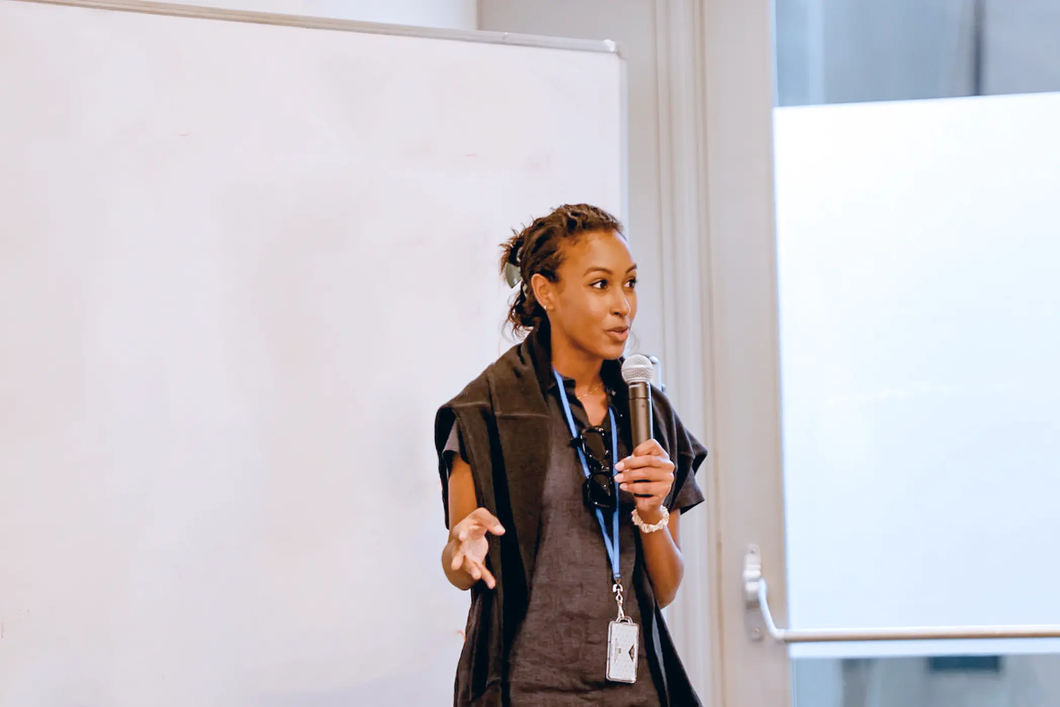 confident young woman speaking at an event